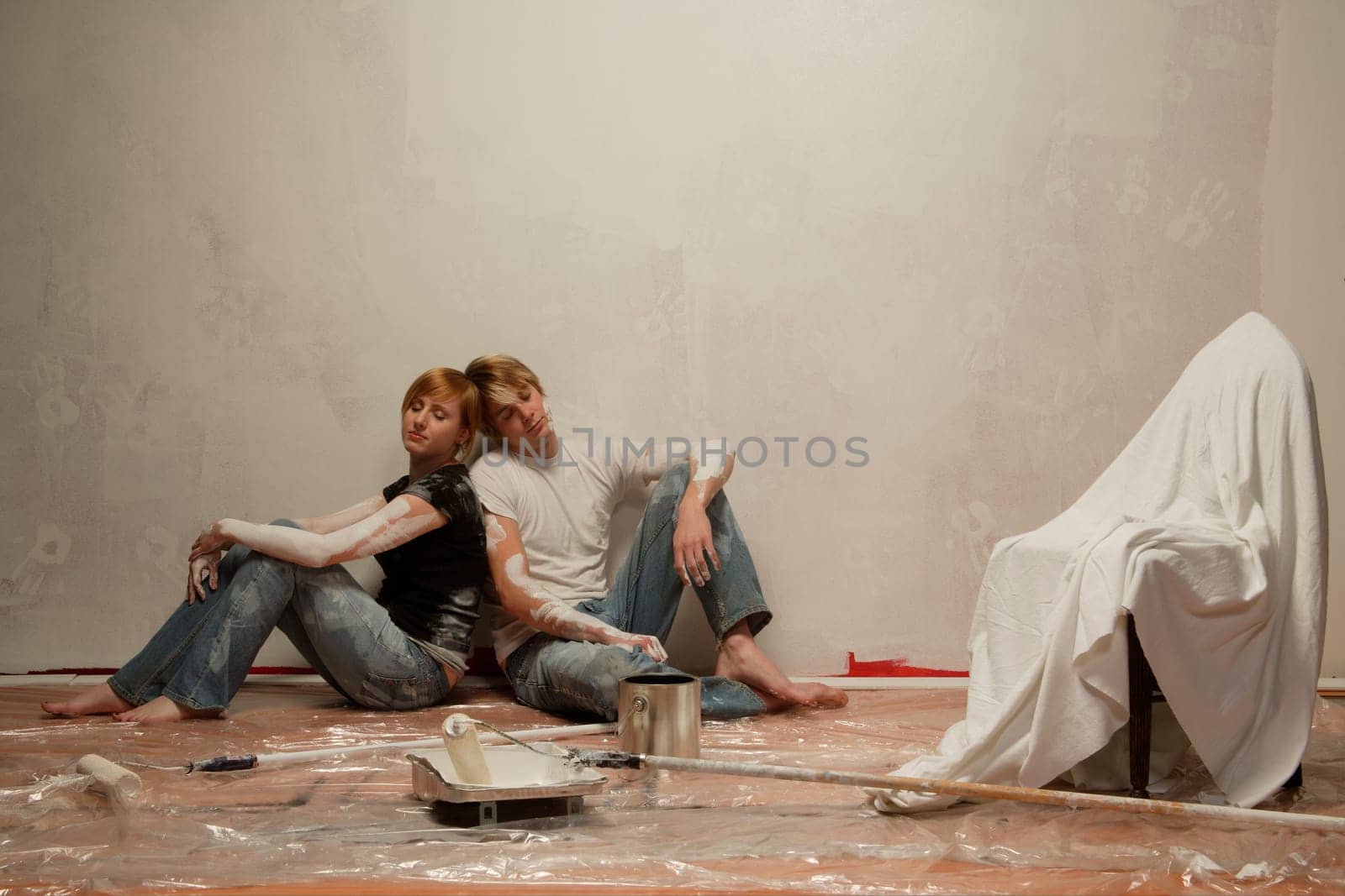 Couple rests after a hard day of painting