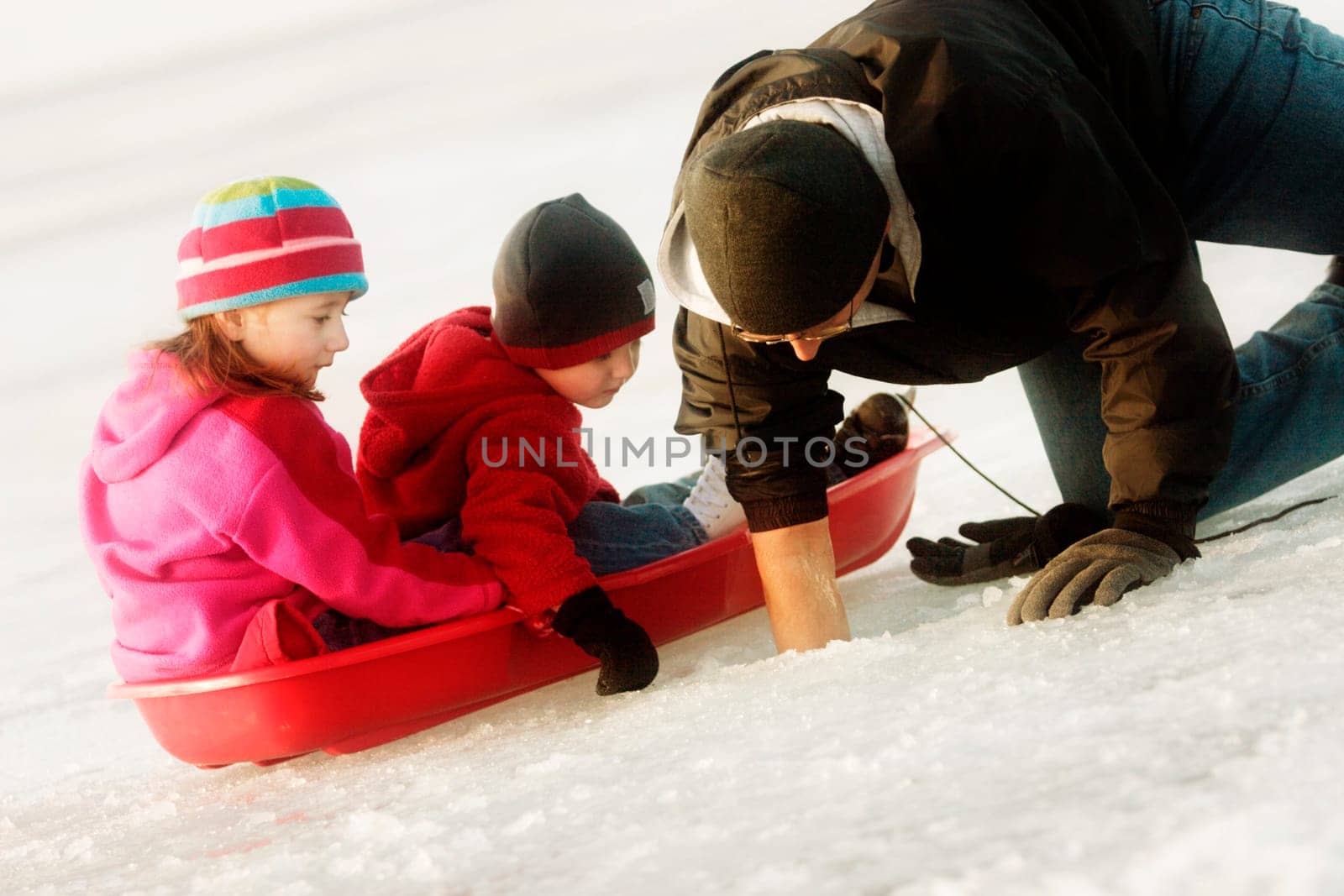 Father with children on ice