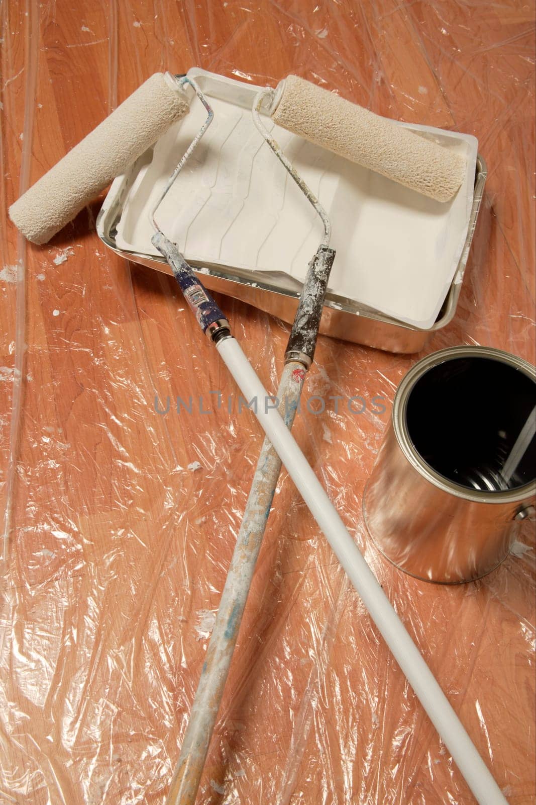 Paint rollers and paint can
