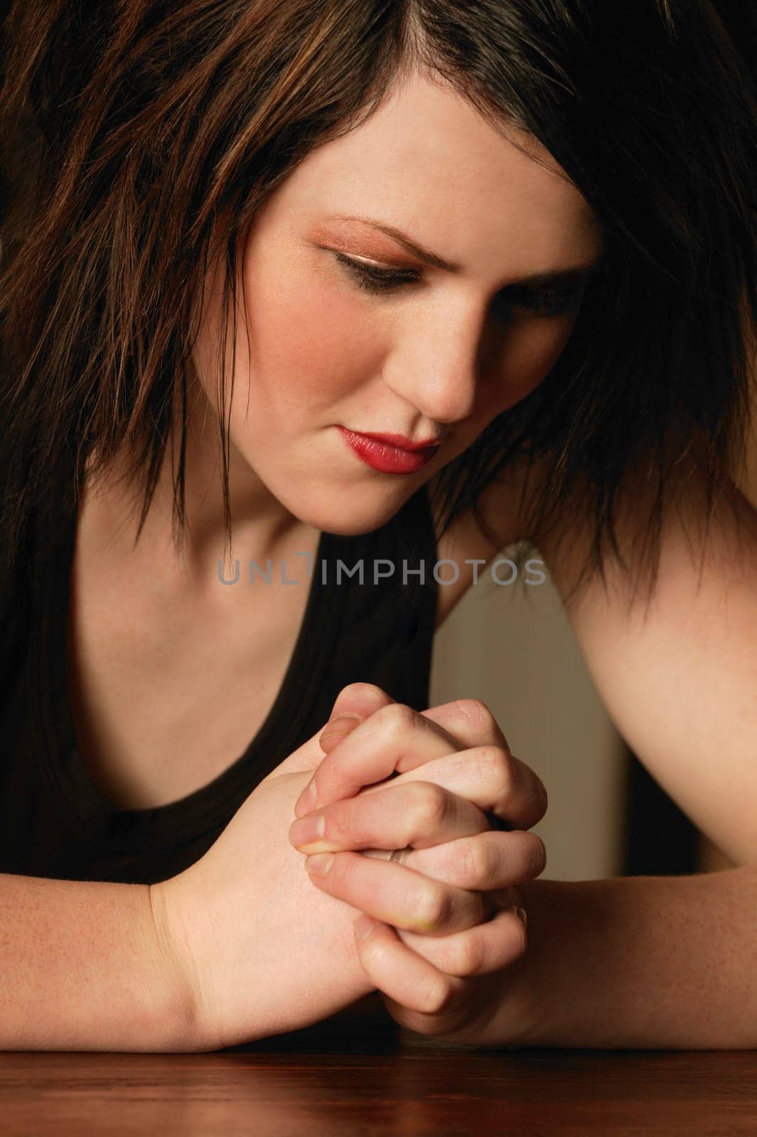 A young woman praying