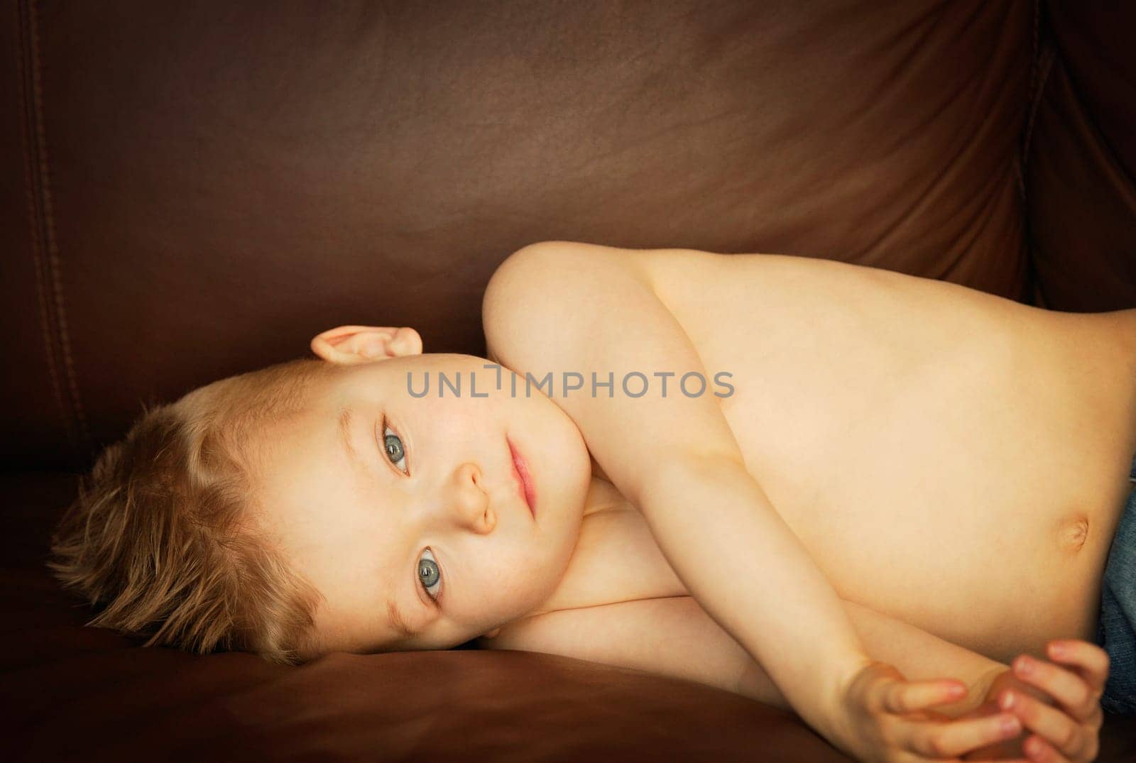 Young boy lying down