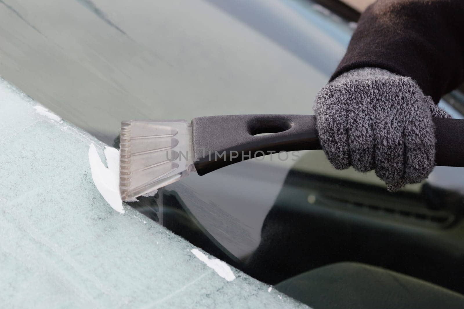 Scraping frost on car window