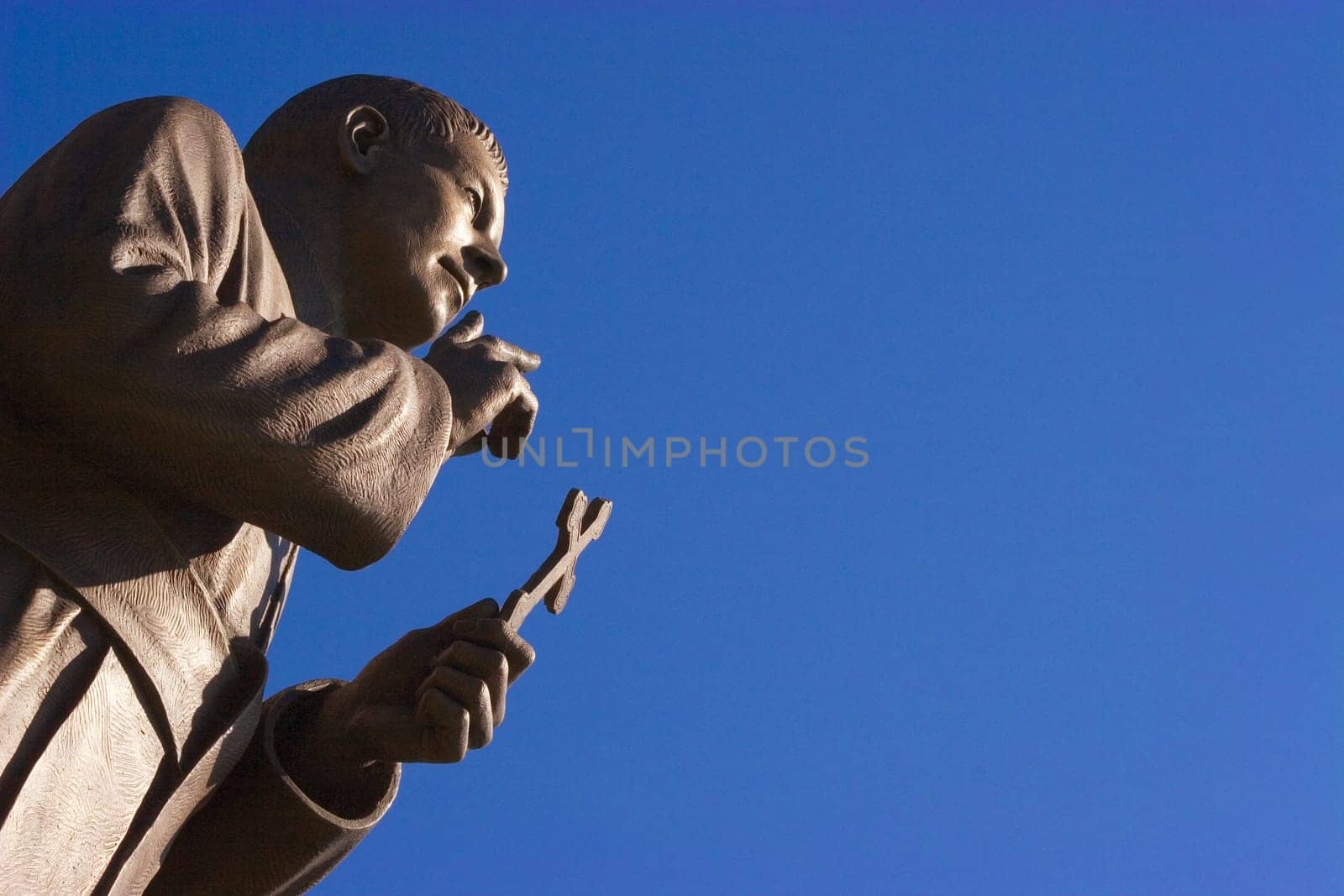 Statue holding cross