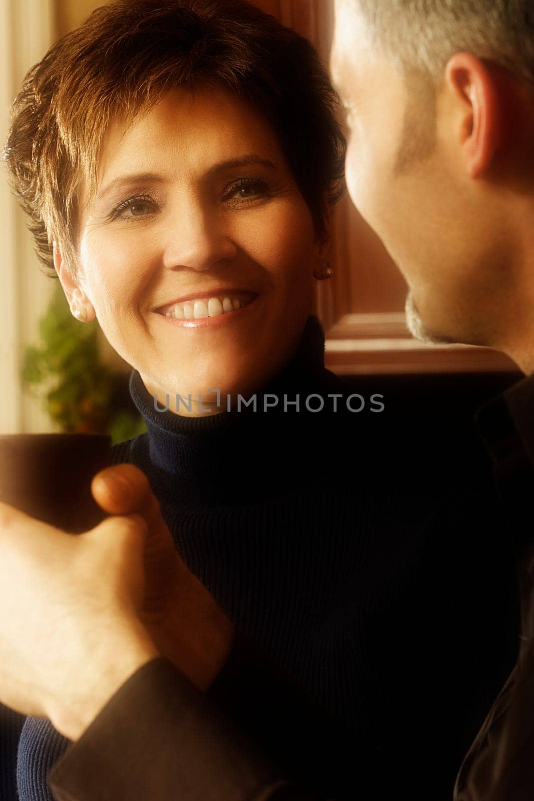 Man and woman conversing over coffee