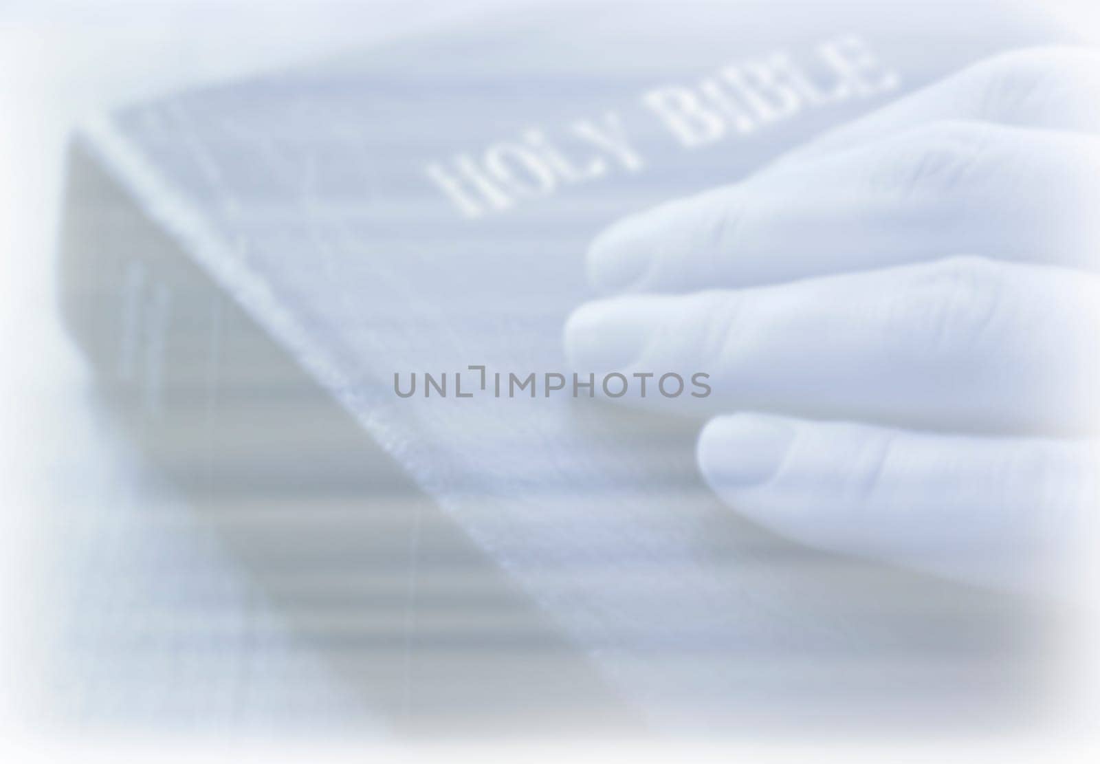 Hand on Bible Background