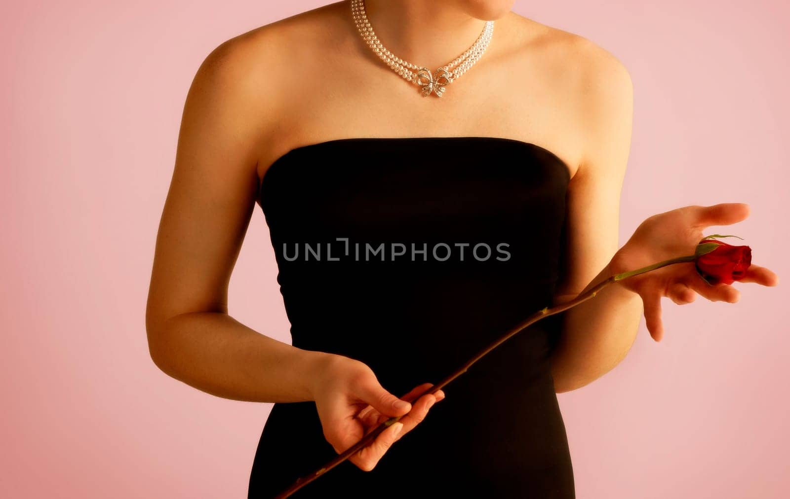 Woman holding a single rose