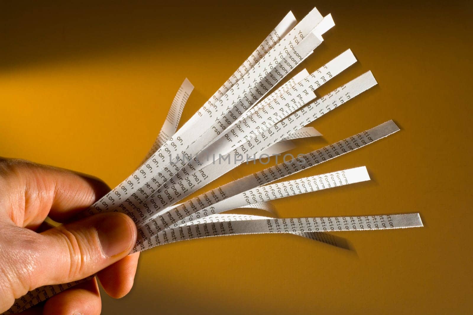 Hand holding shredded paper
