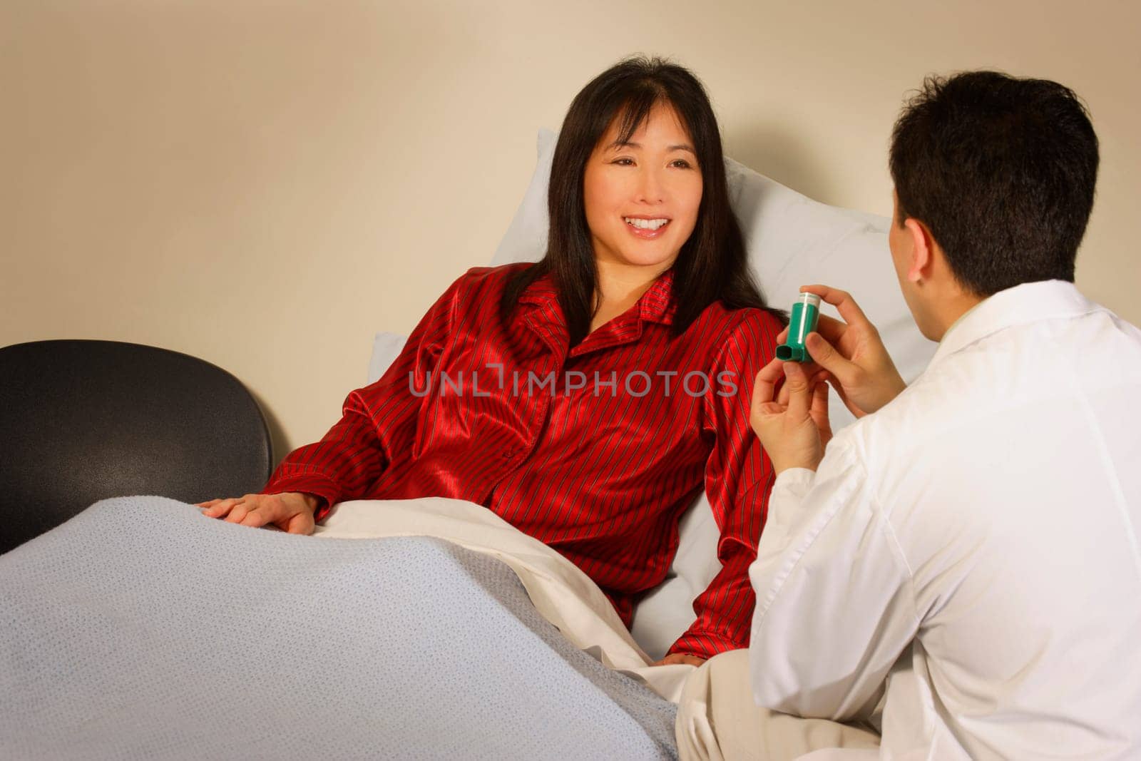 Doctor instructing patient about inhaler