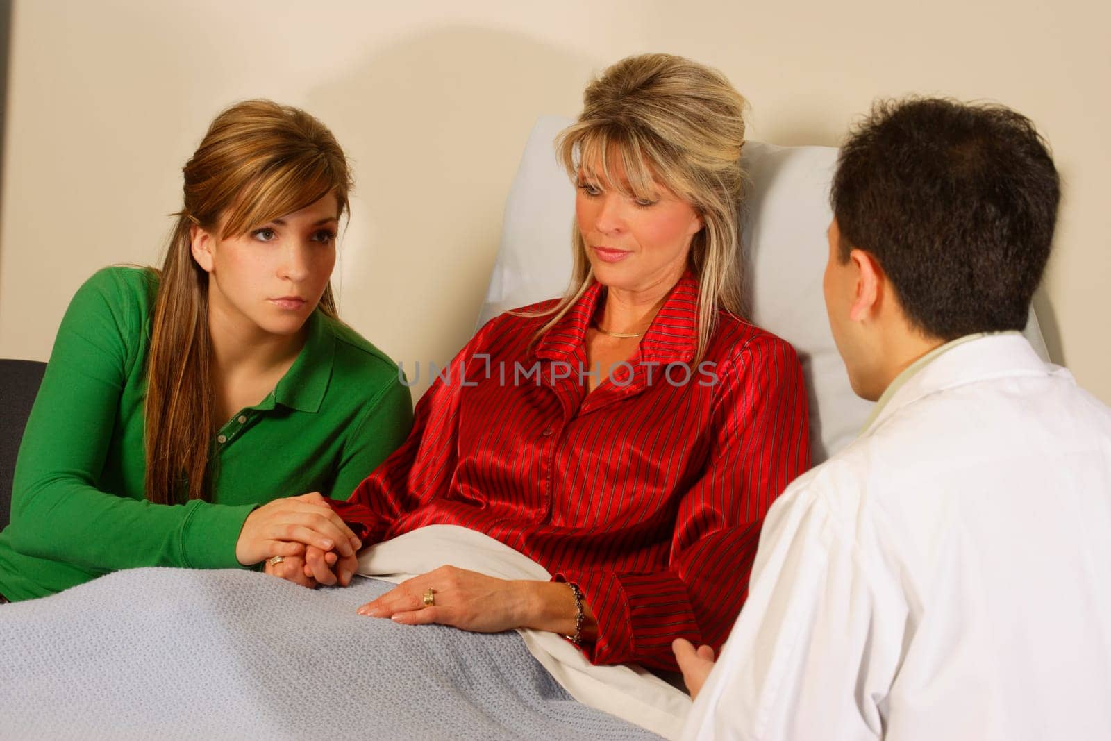 Doctor talking to patient and daughter