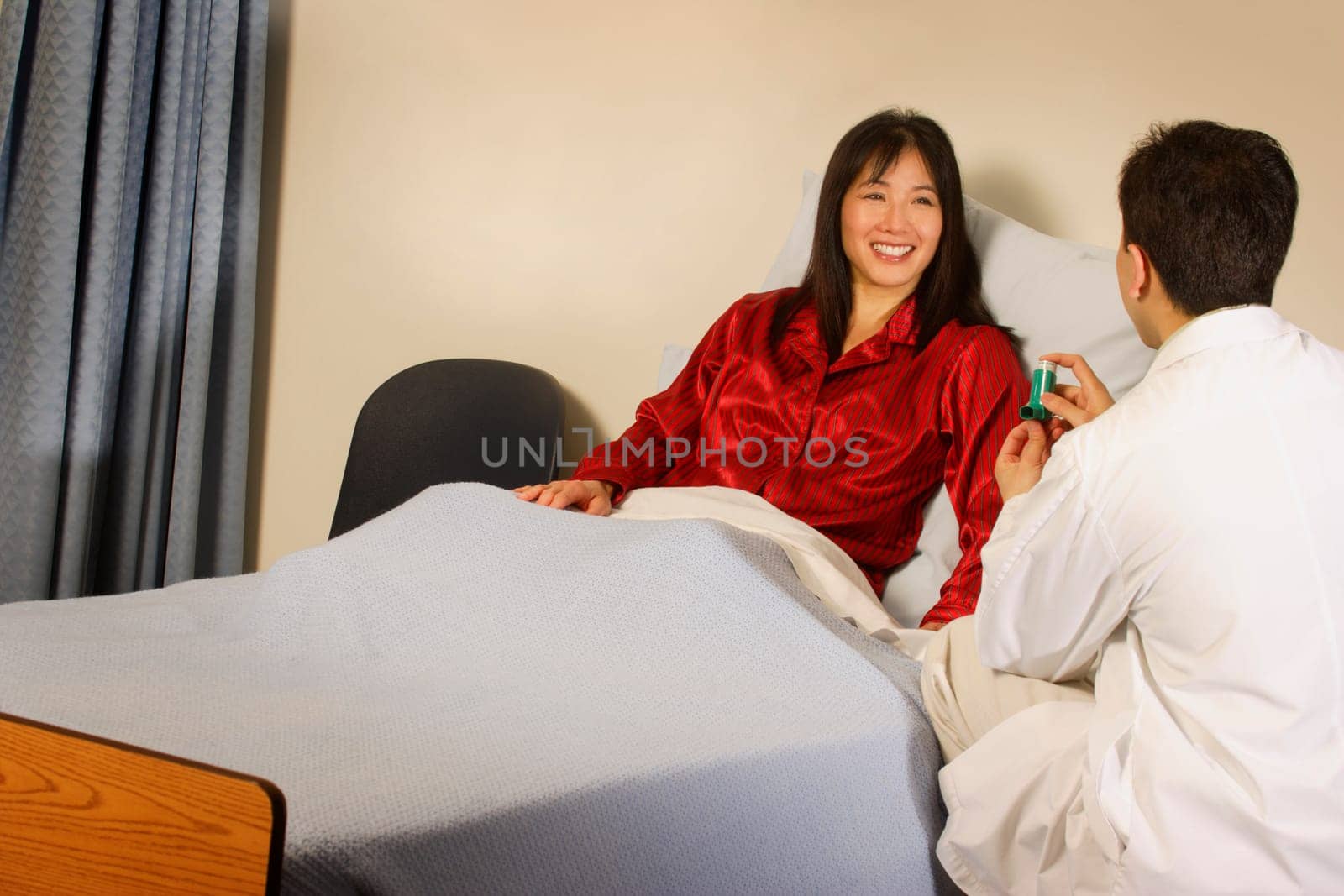 Doctor instructing patient on inhaler