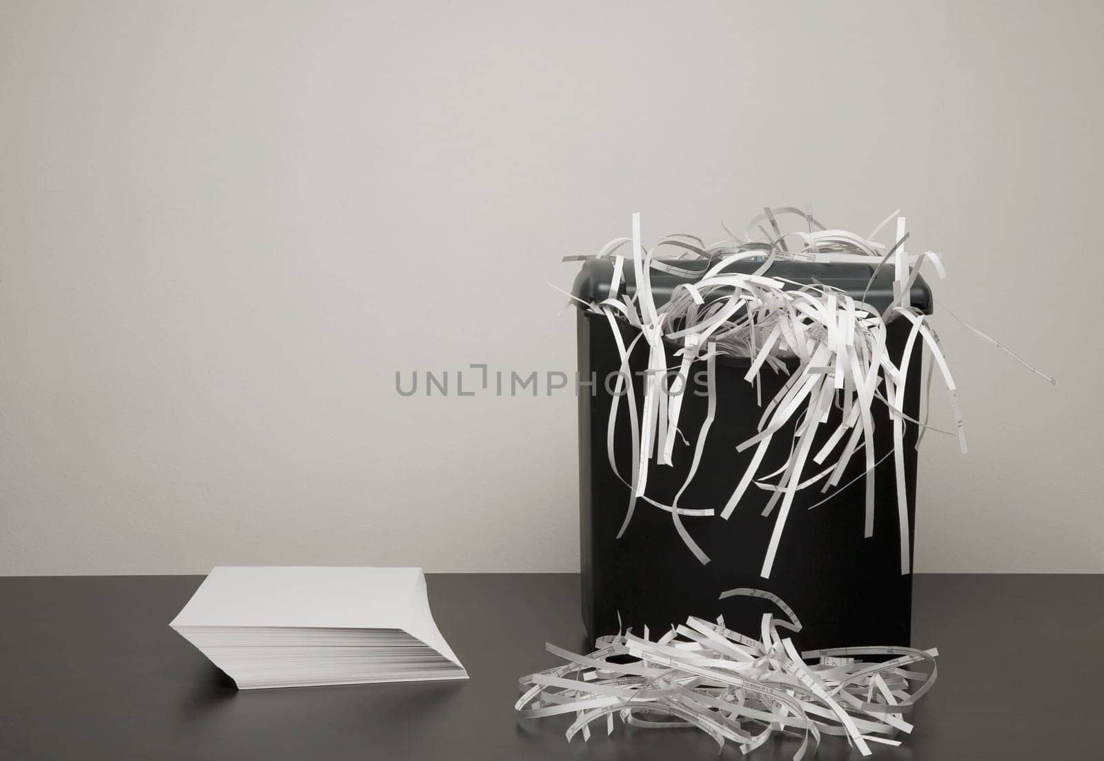 Shredded paper in a garbage can