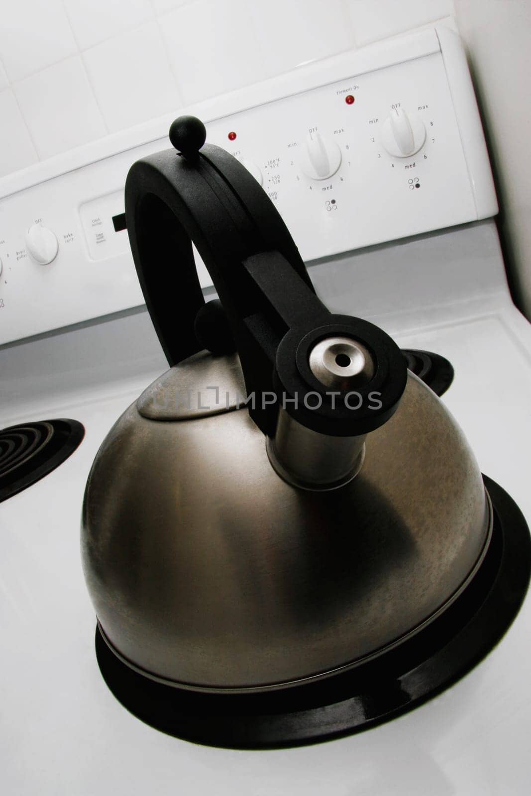 Stainless steel tea kettle on stove