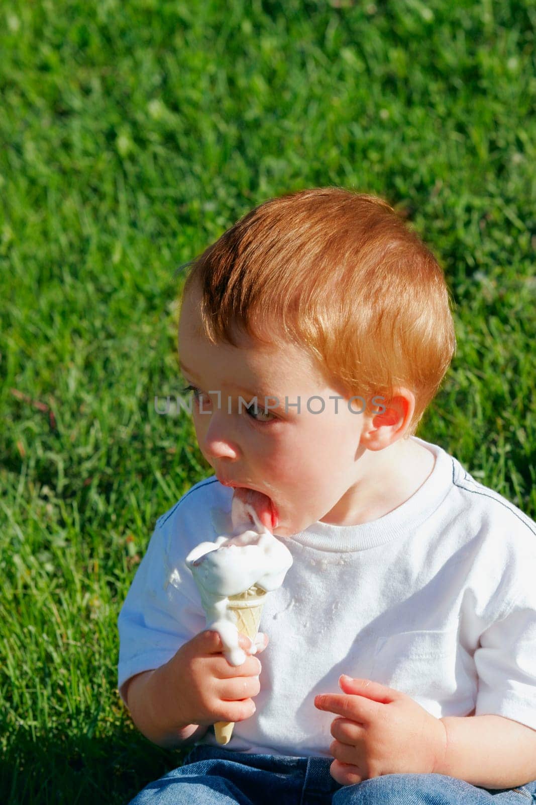 Young boy eating ice cream