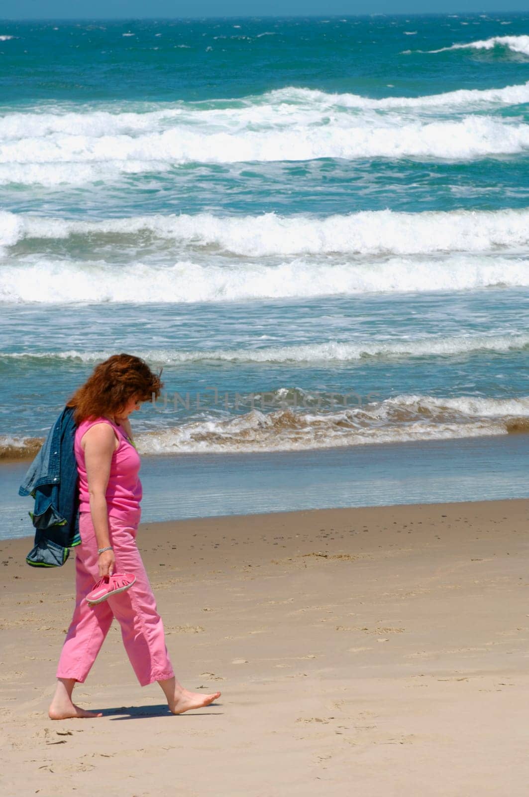 Woman walking on the beach