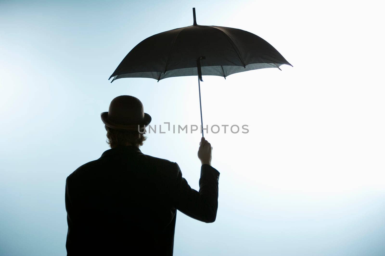 Person holding umbrella