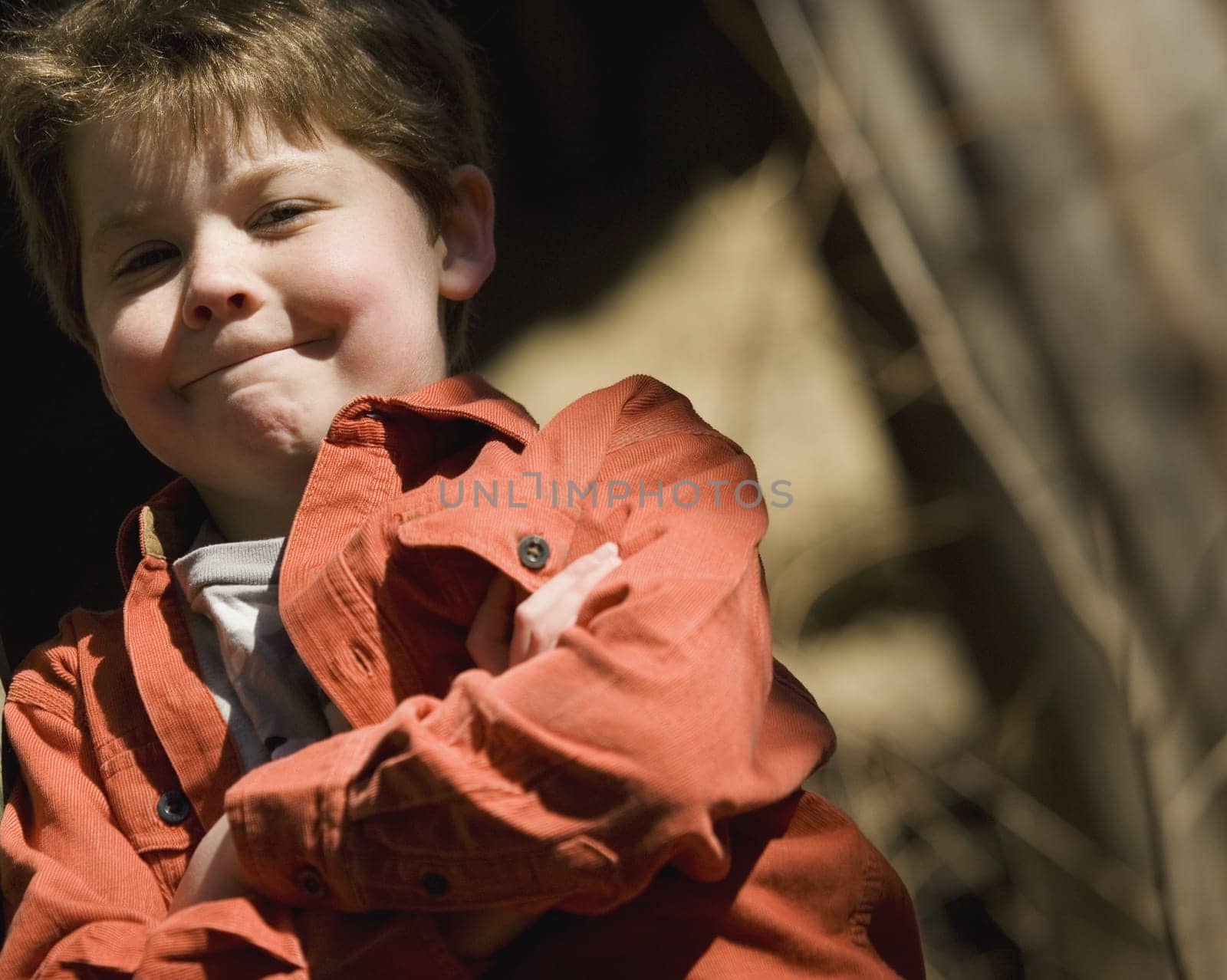 Boy with arms crossed