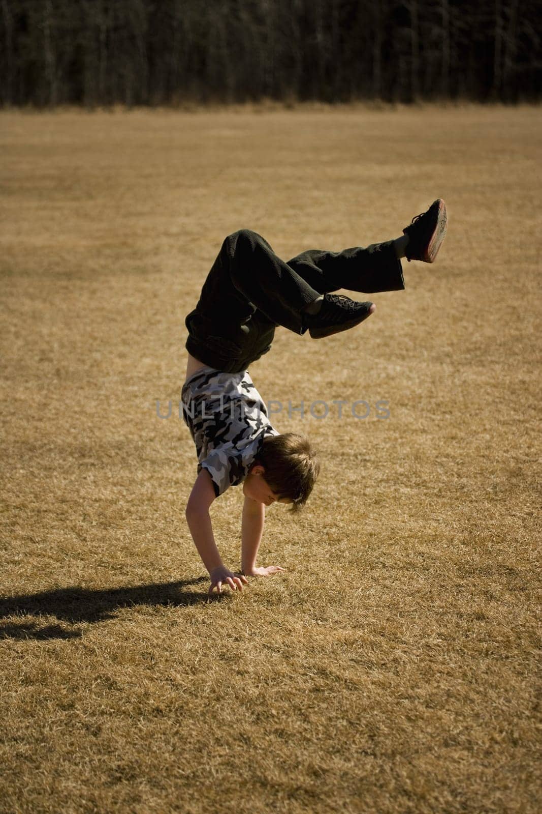 Boy doing a hand stand
