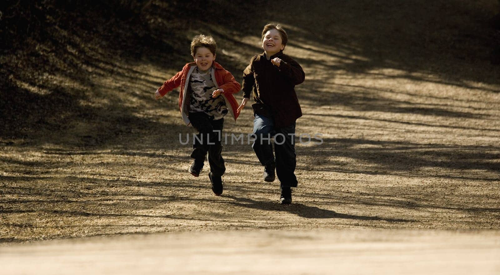 Boys running together