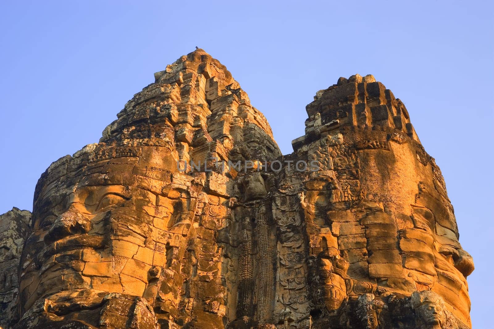 Stone heads on gate Angkor Thom, Siem Reap Cambodia