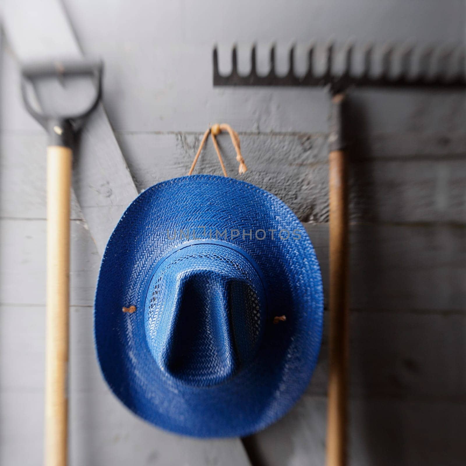 Hat hanging with gardening tools