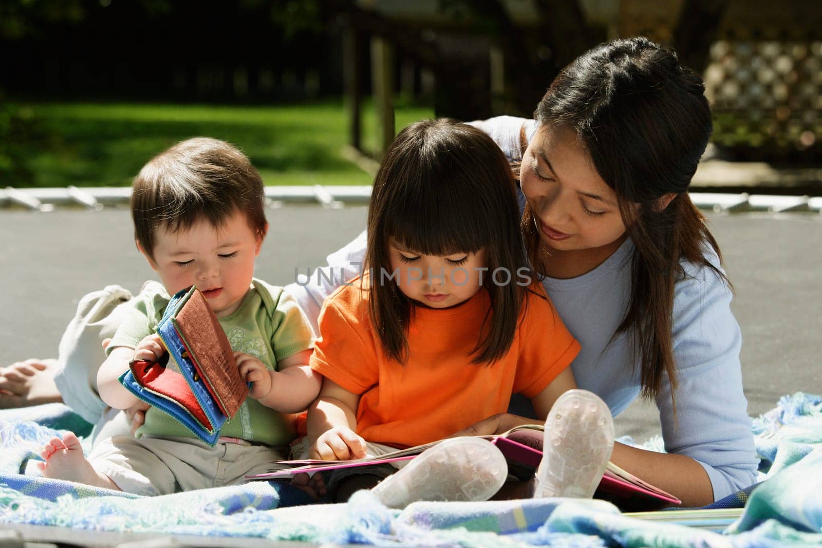 A mother reading to her children
