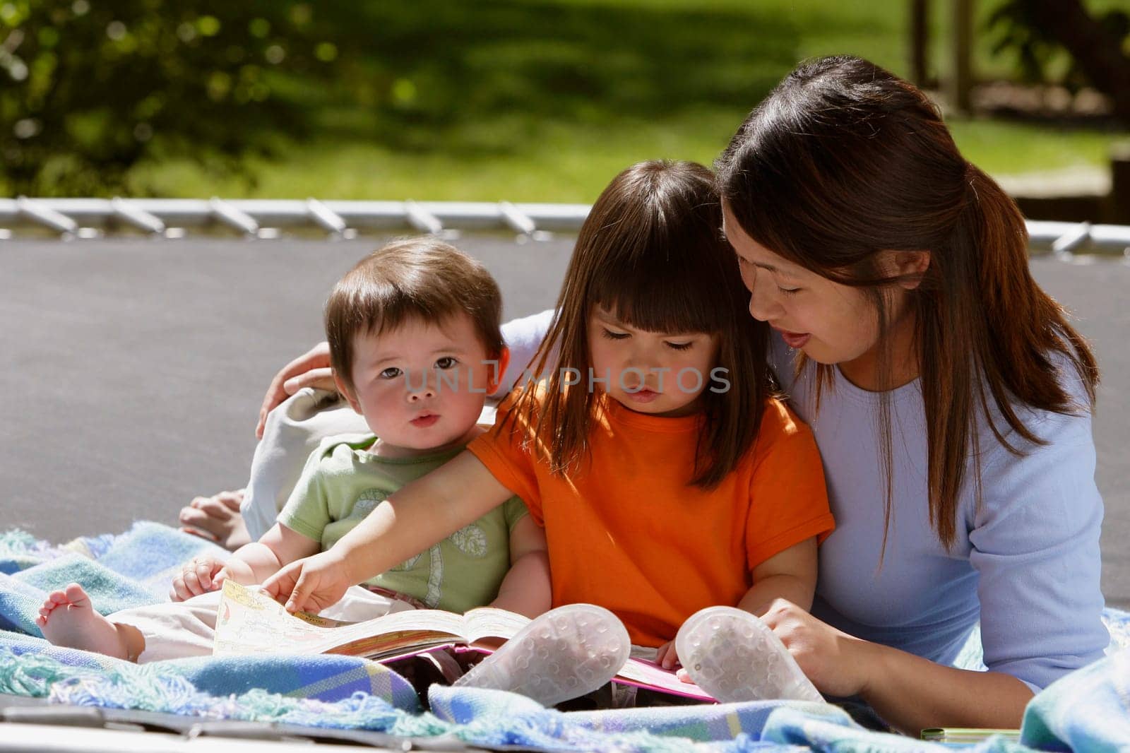 A mother reading to her children