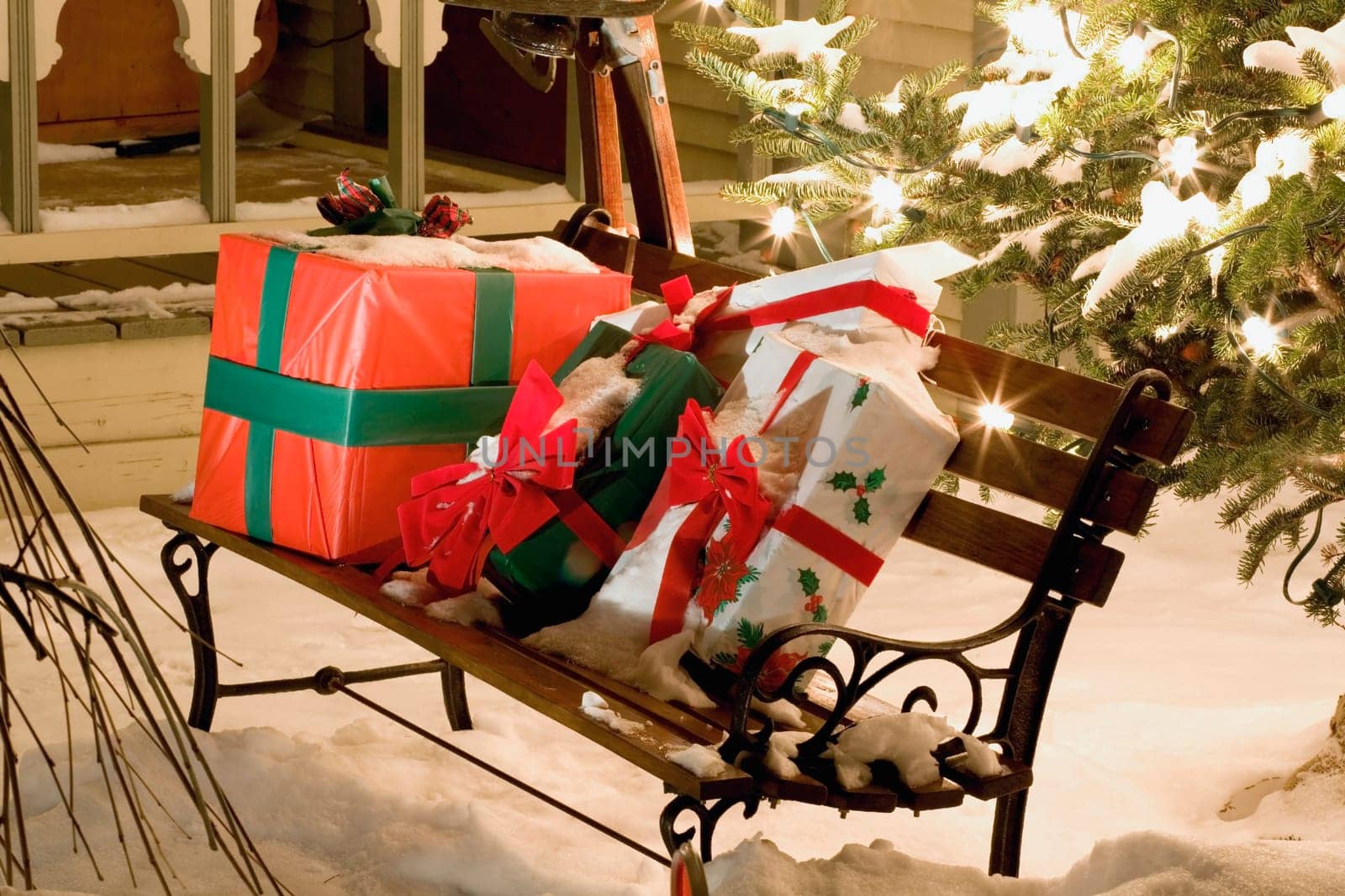 Wrapped presents sitting on a park bench outside