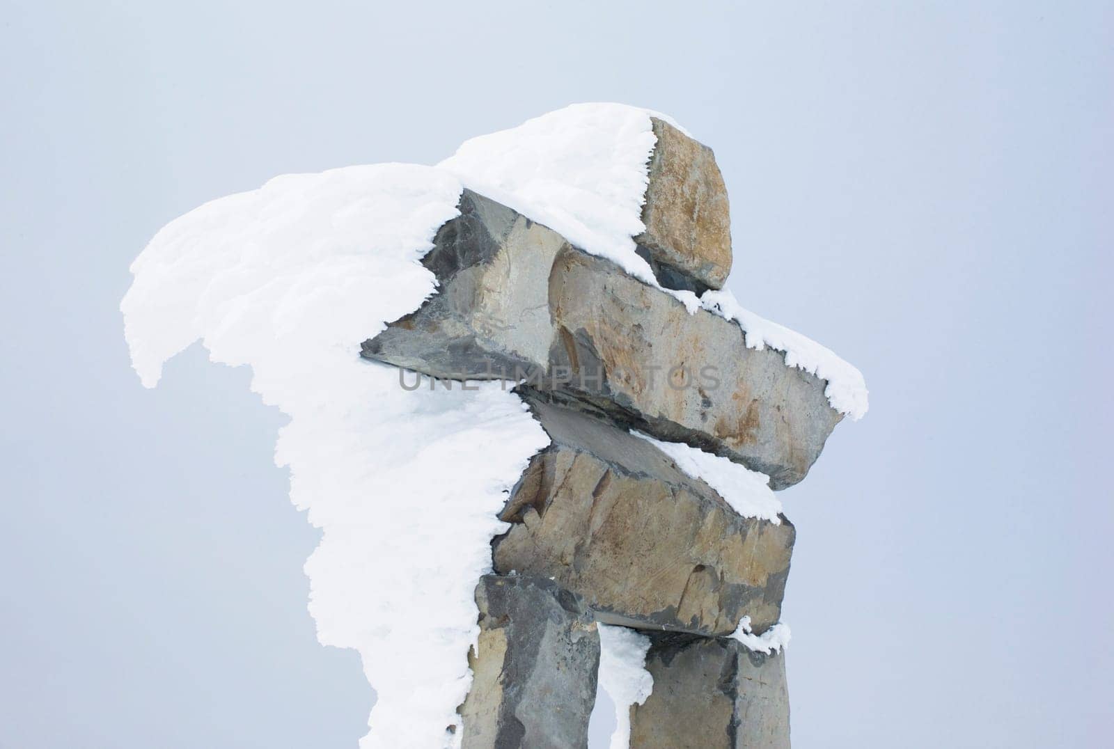 Snow-covered inuksuk