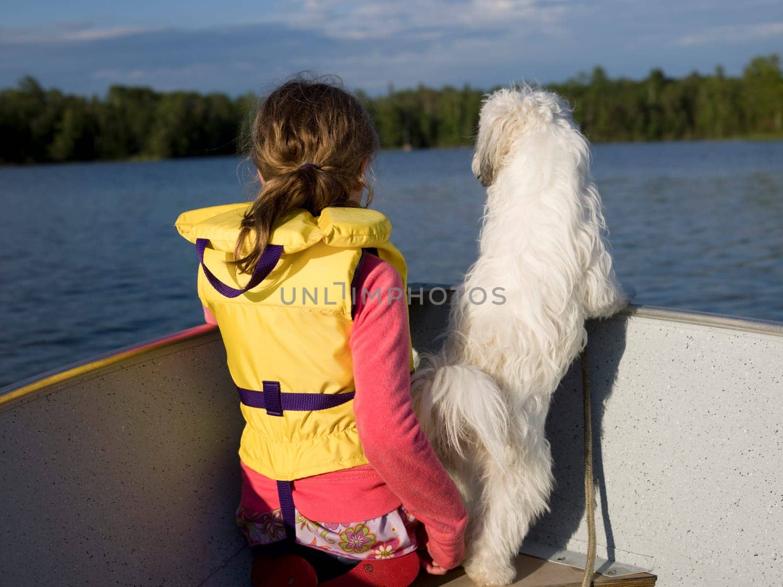 Girl and dog on a boat