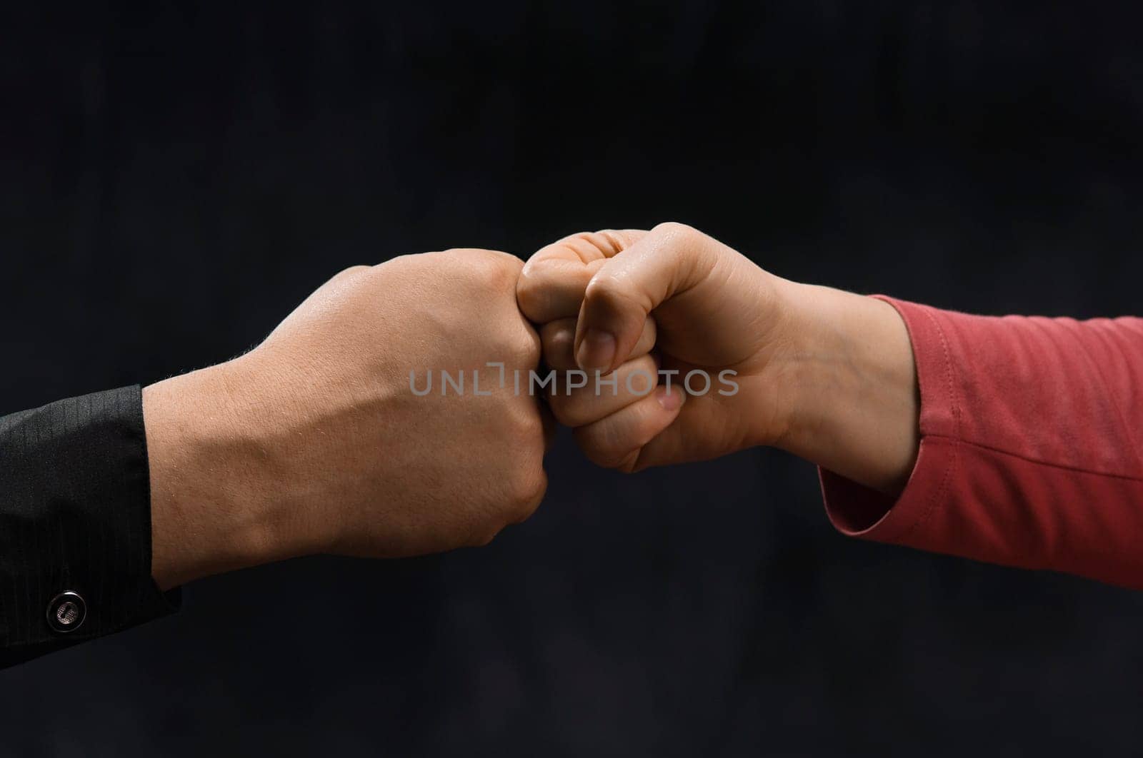 Man And woman friendly knocking fists