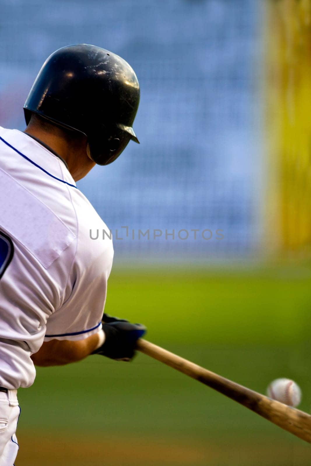 Rear view of a baseball player at bat