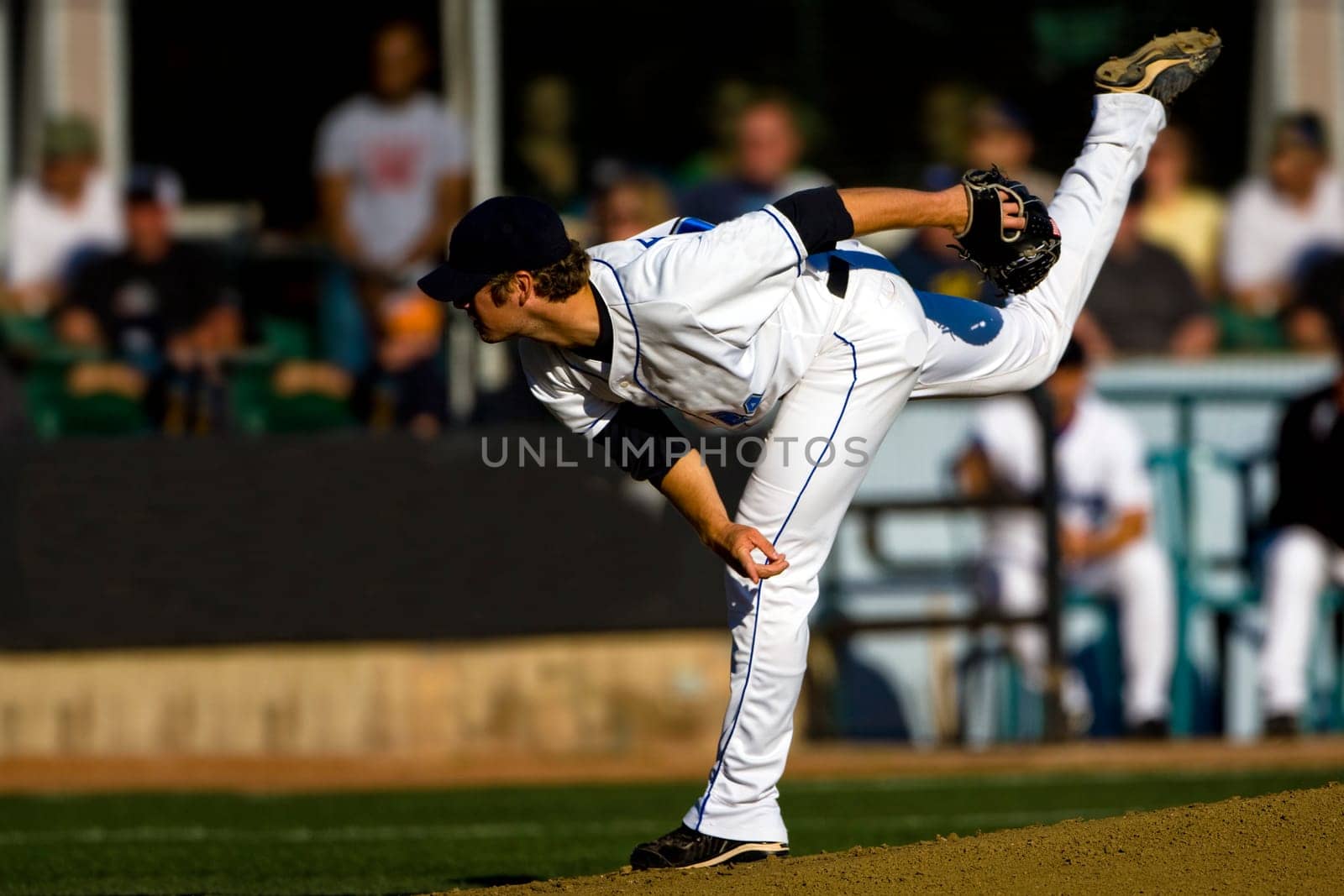 A baseball playing throwing the ball