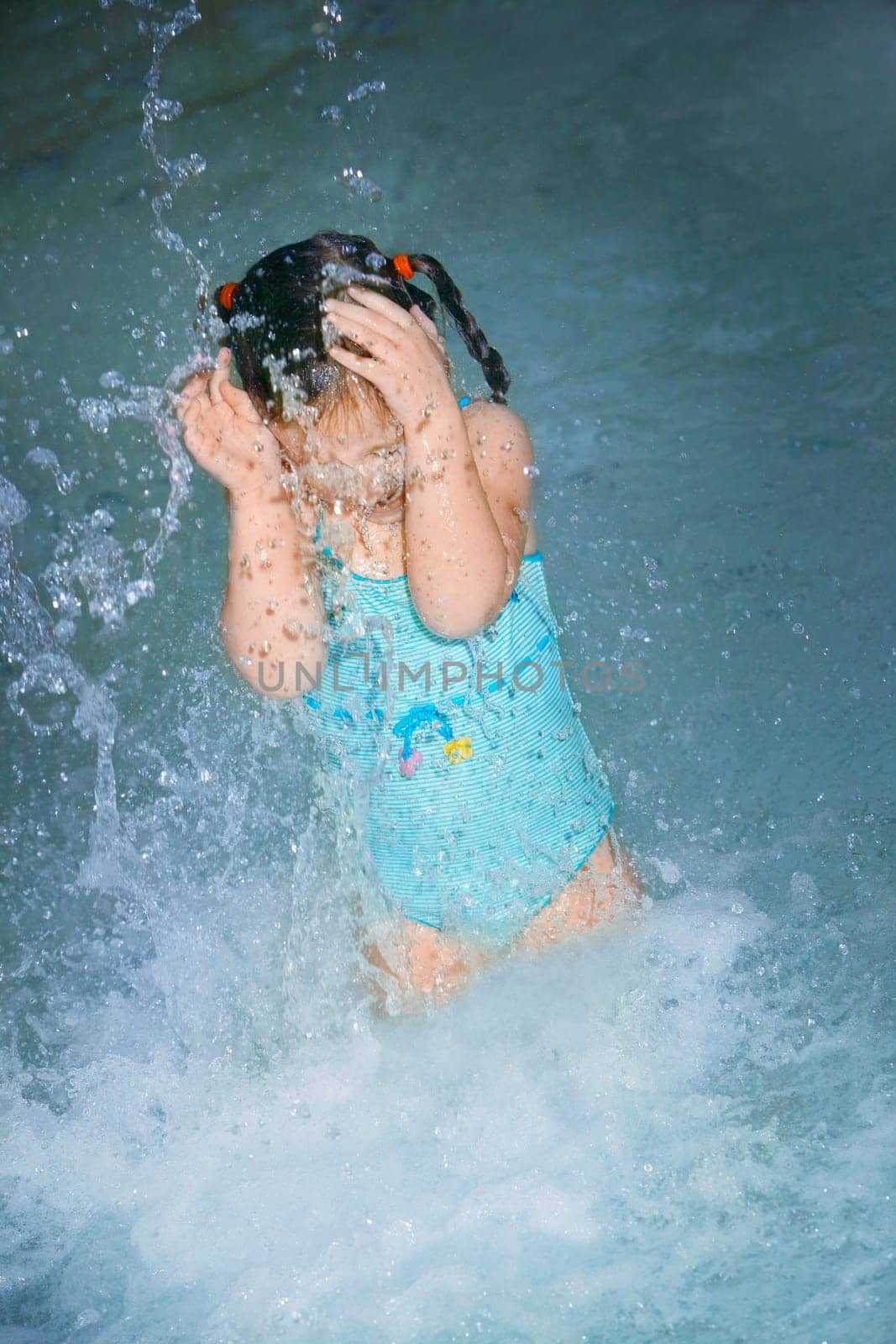 Girl splashing in the water