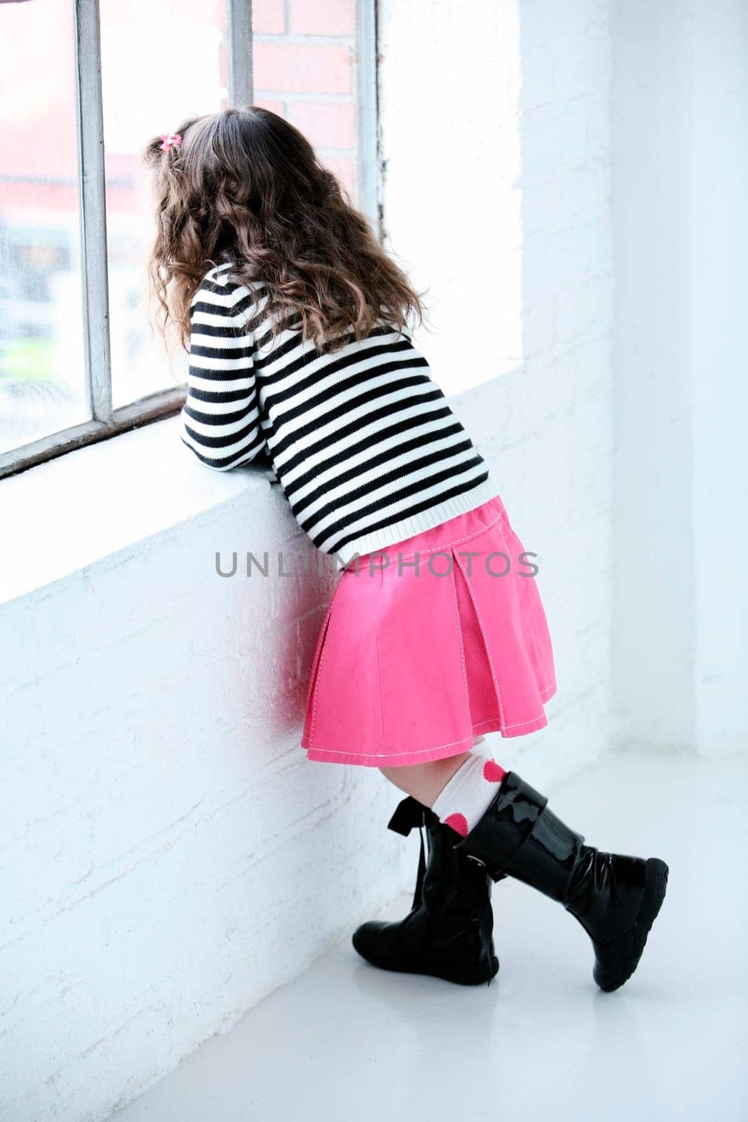 Girl looking out the window
