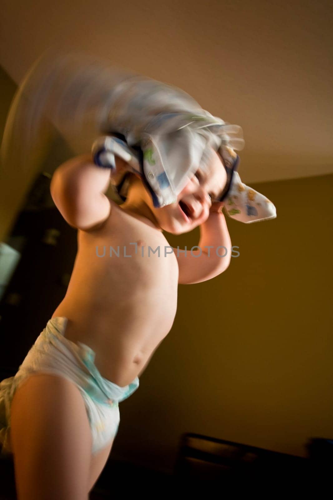 Child playing with pajamas