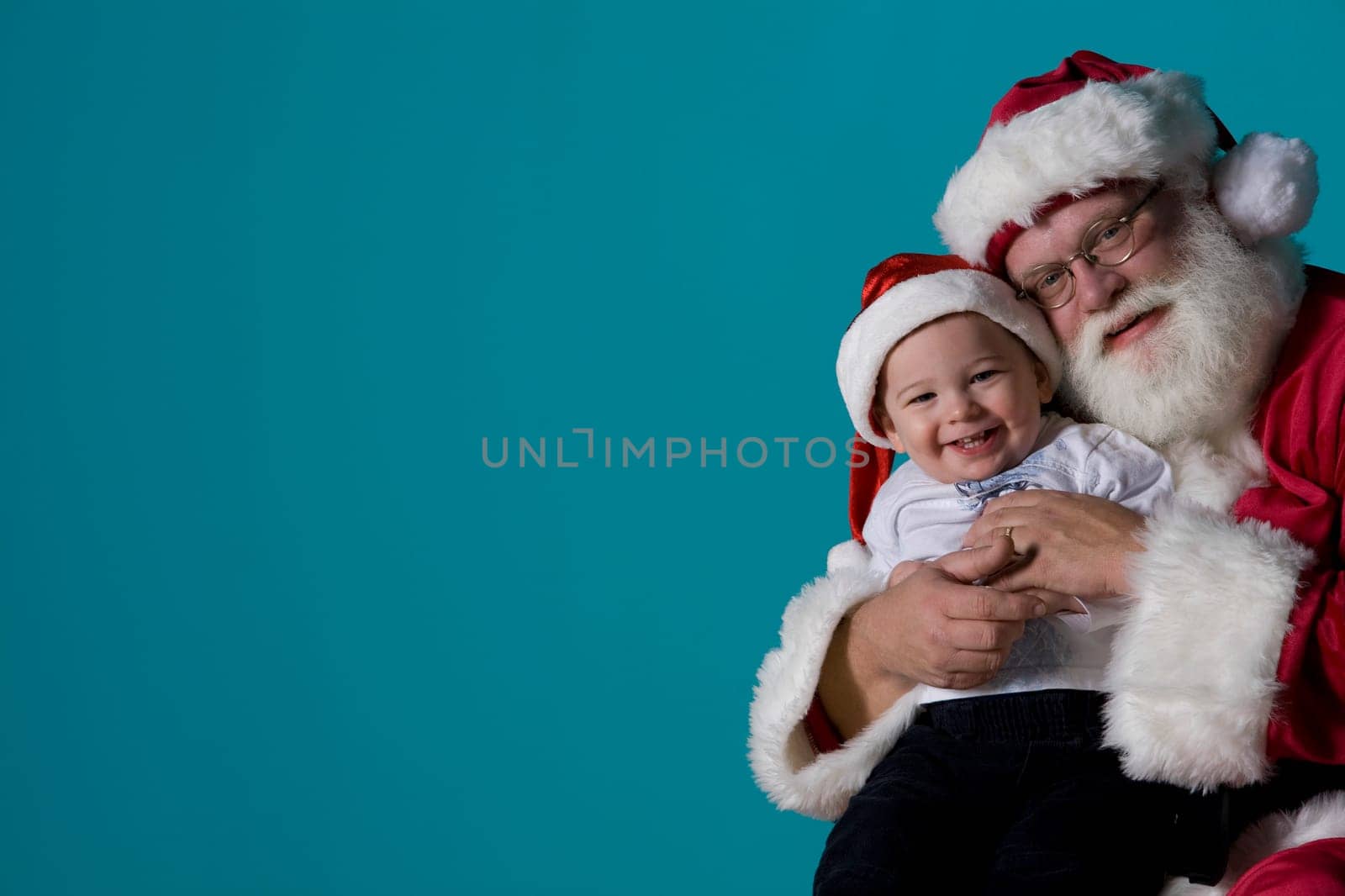 Portrait of Santa with a baby