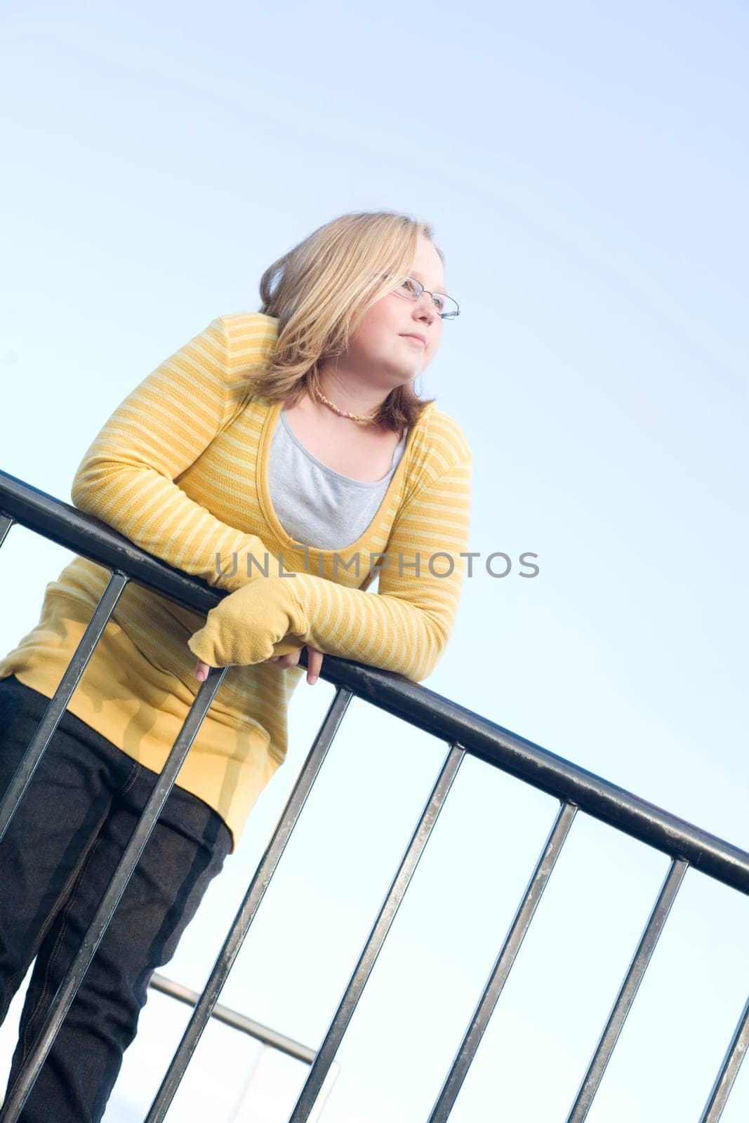 Girl leaning on railing