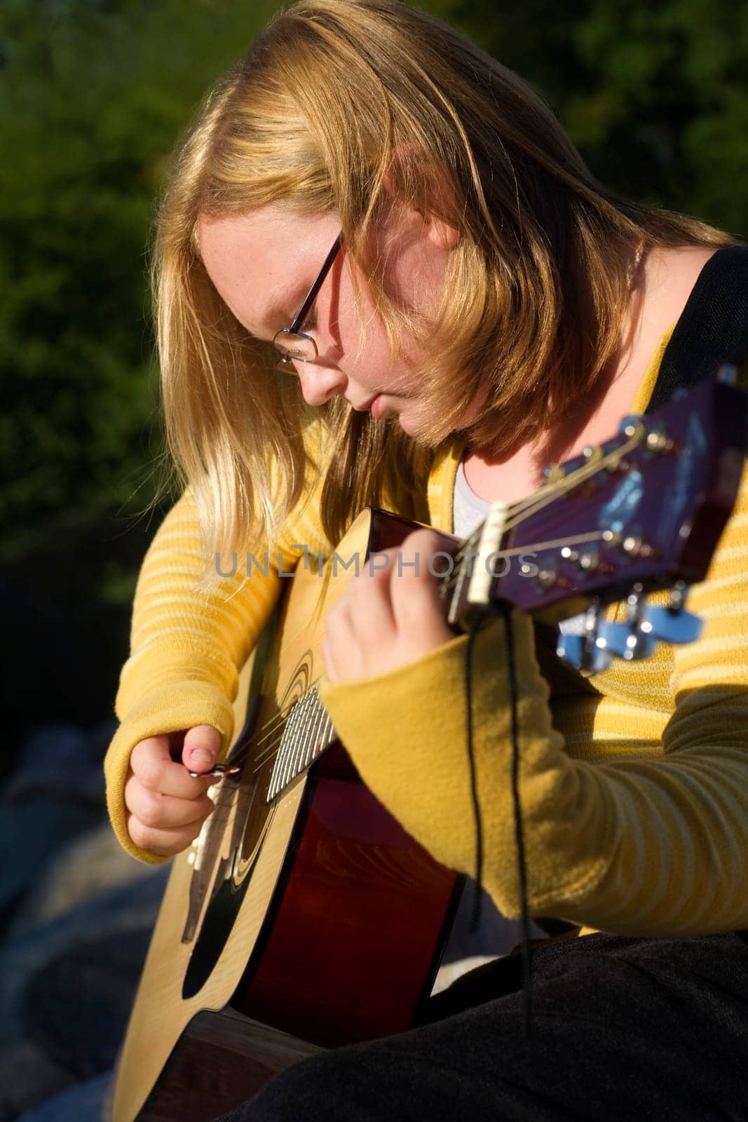 Teen playing guitar