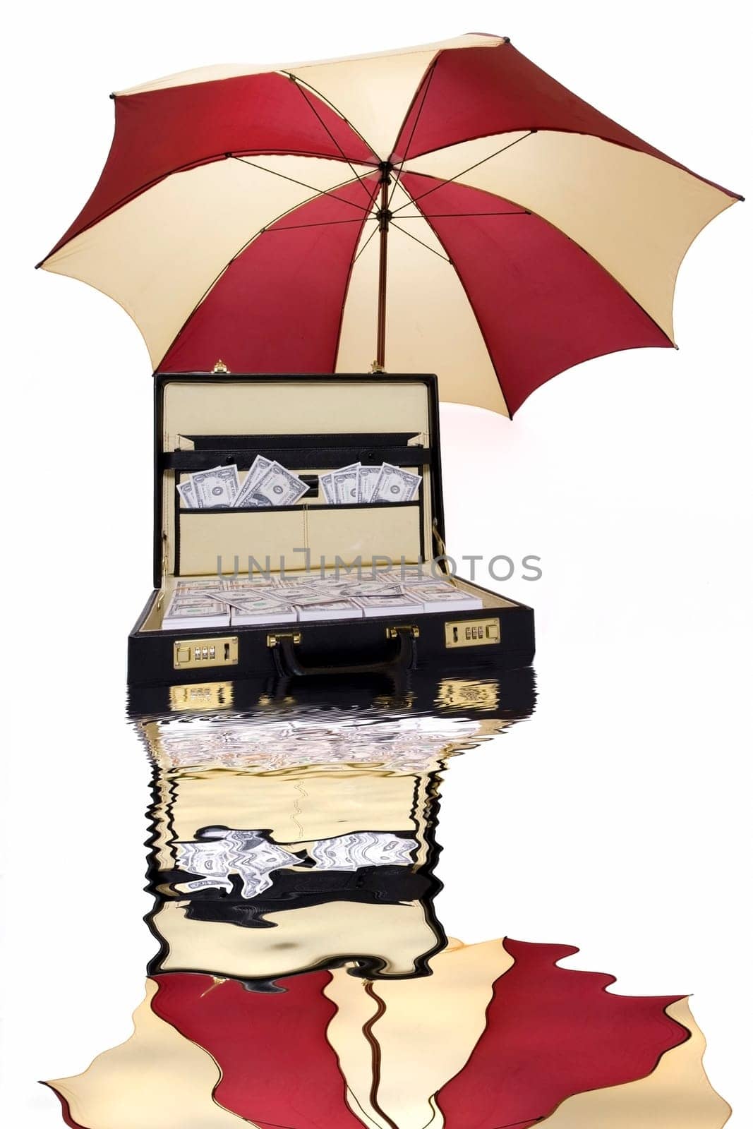Suitcase full of money with umbrella above