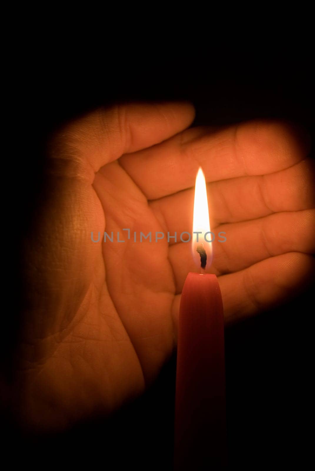 Hand and candle