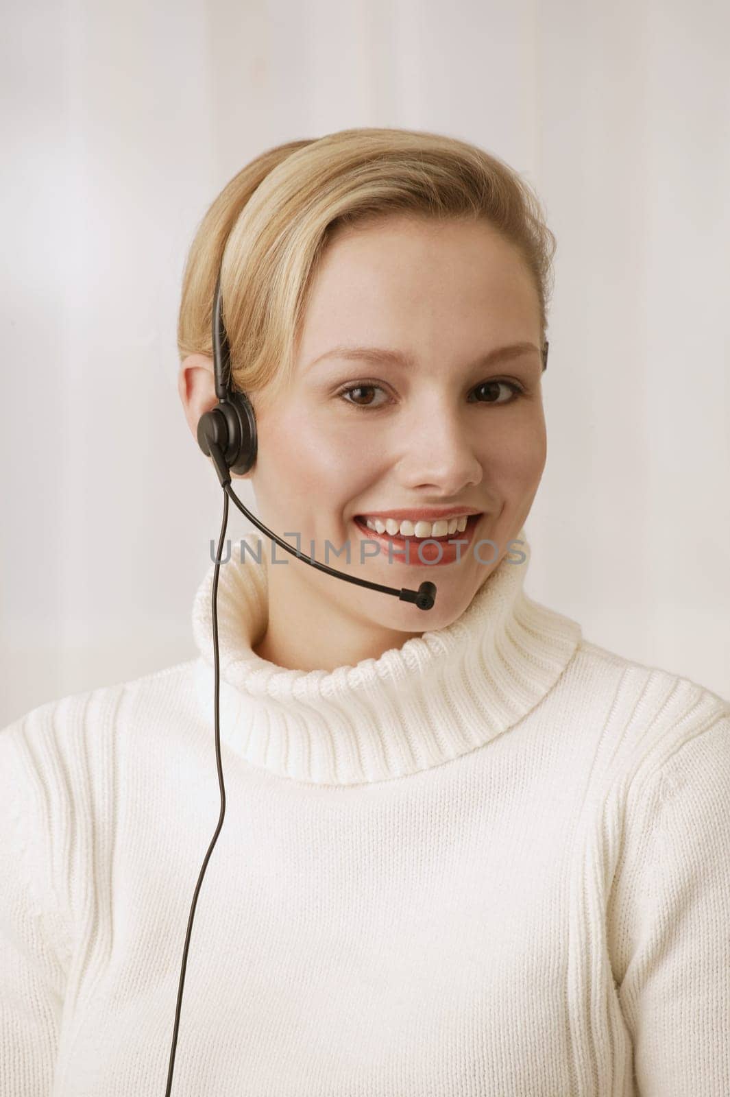 Woman wearing telephone headset