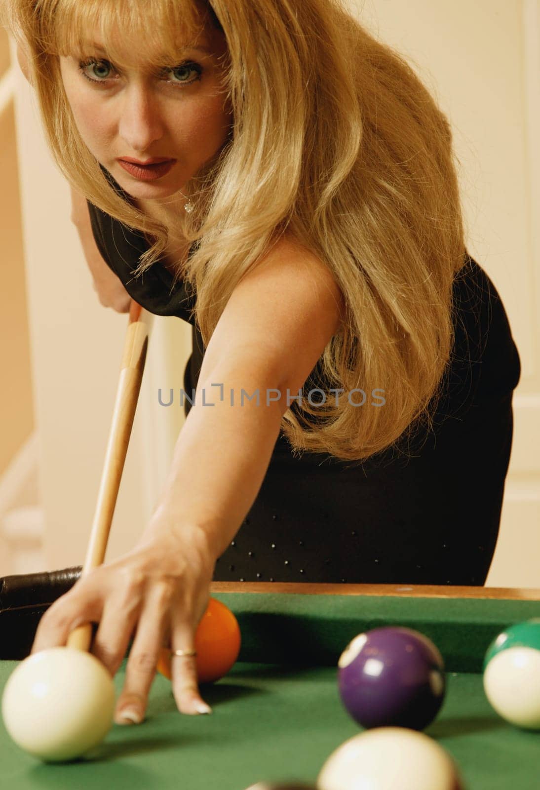 Woman playing pool