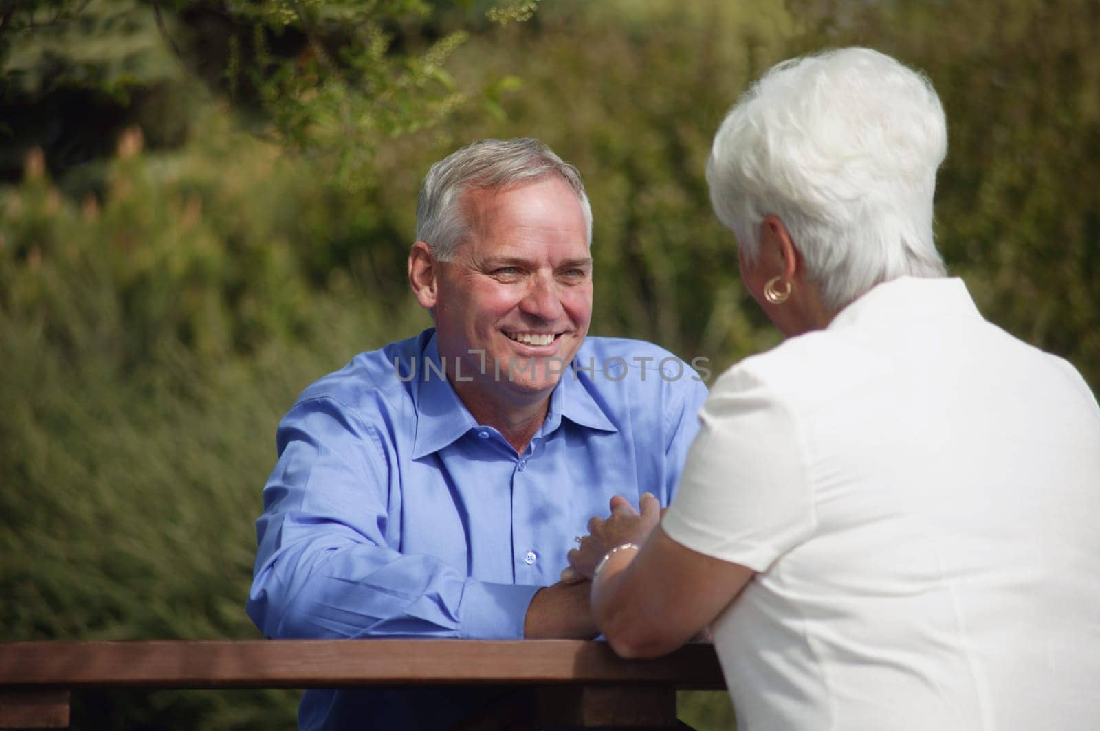 Couple sits outside together