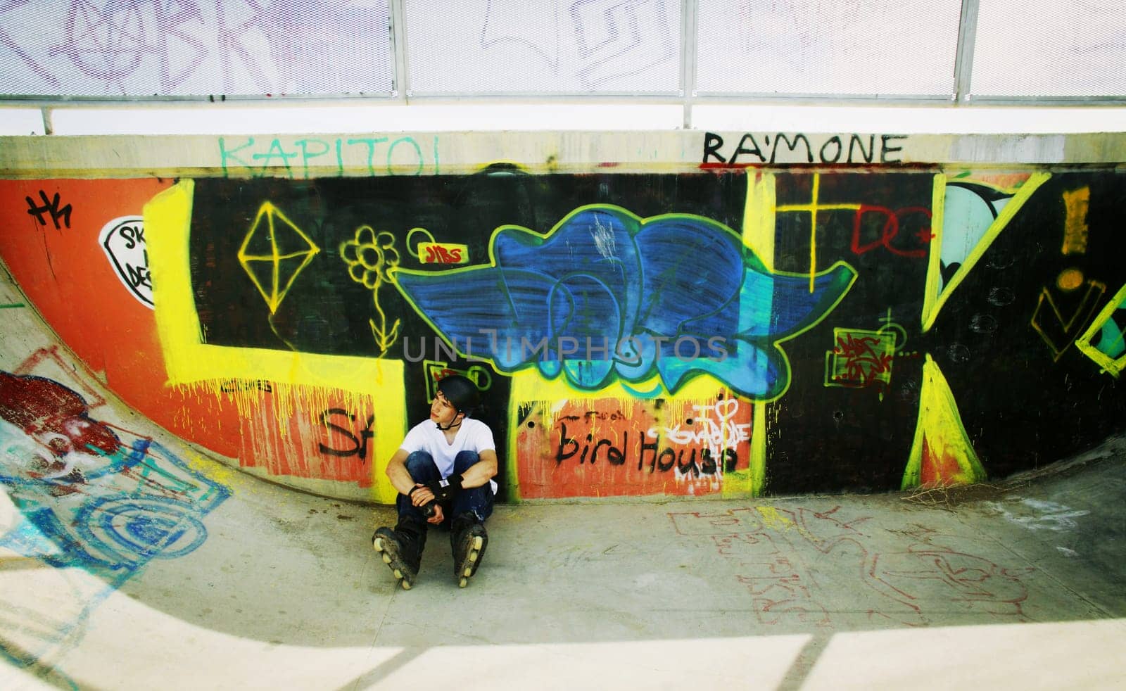 Skater sitting in park