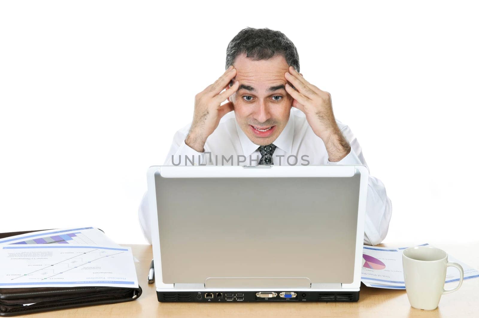 Businessman at his desk on white backgro