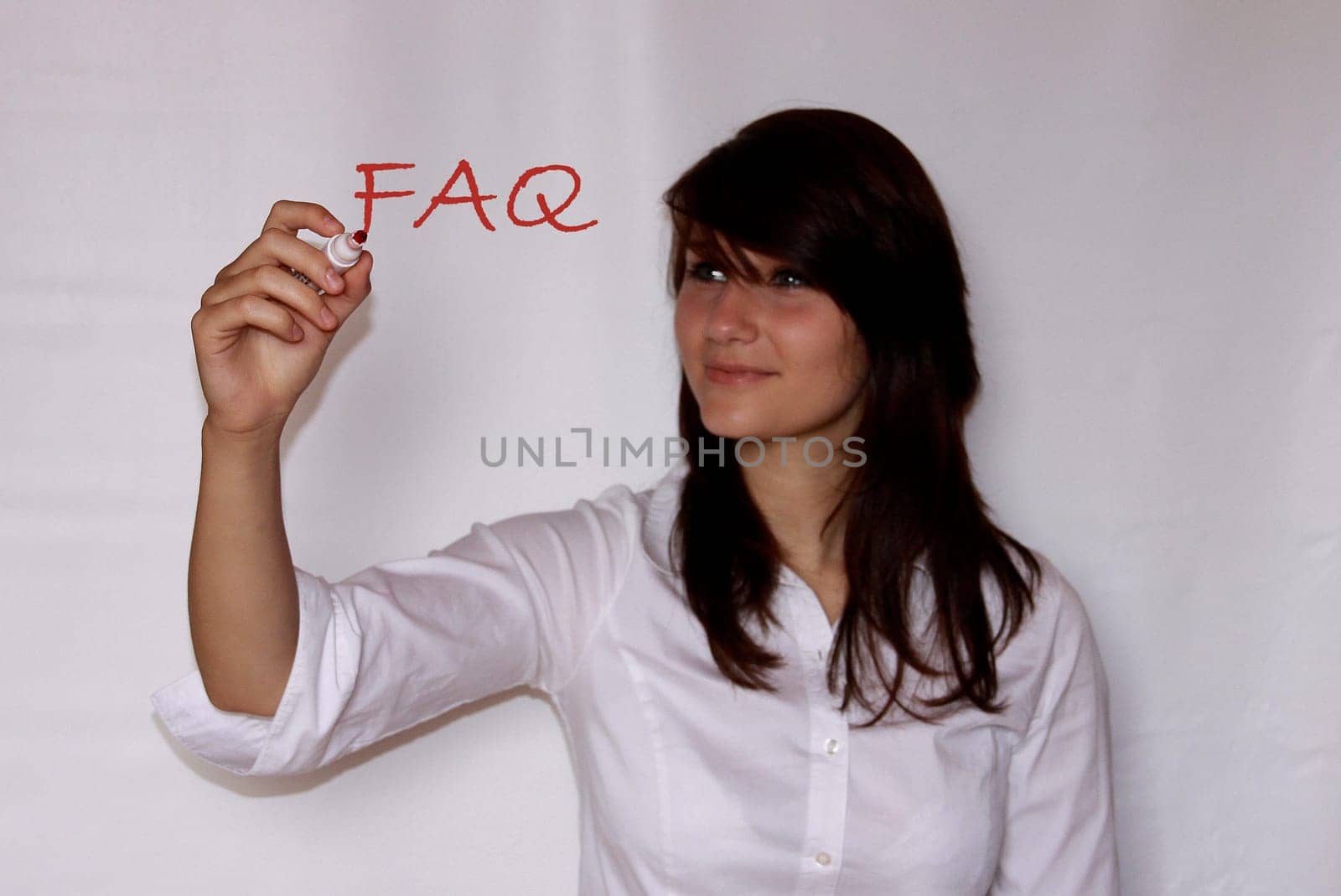 Young woman writes faq