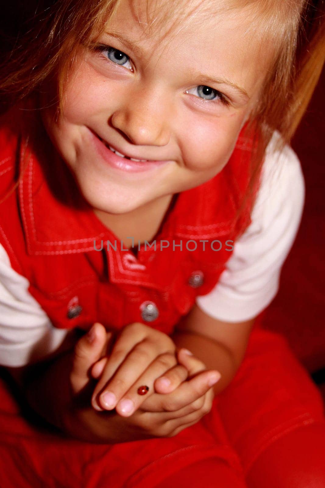 Pretty,blonde girl with ladybug