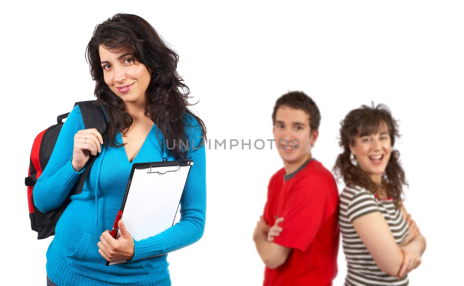Three students with books and backpacks