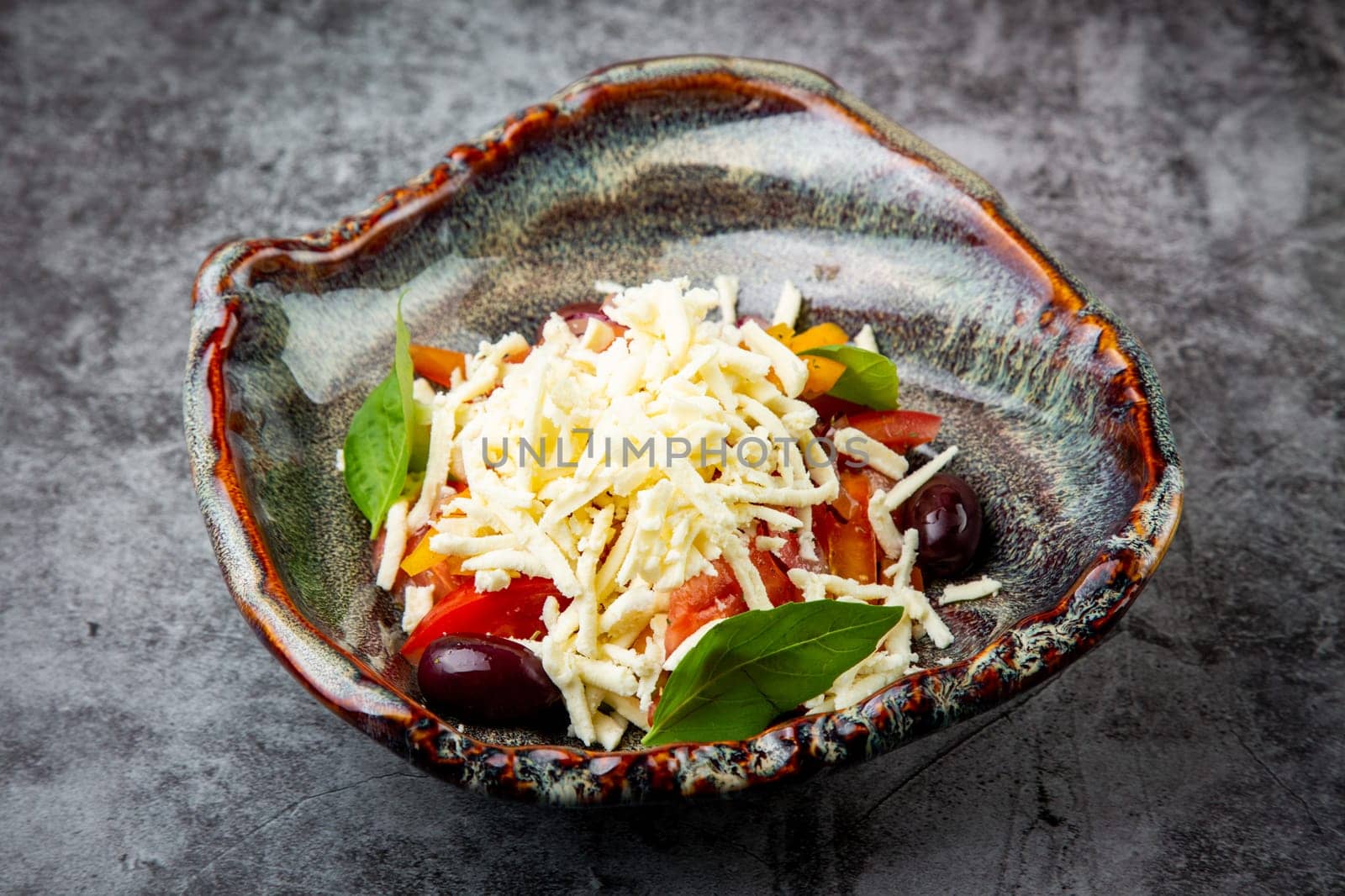 salad with tomatoes, basil, sweet peppers and cheese, side view by tewolf