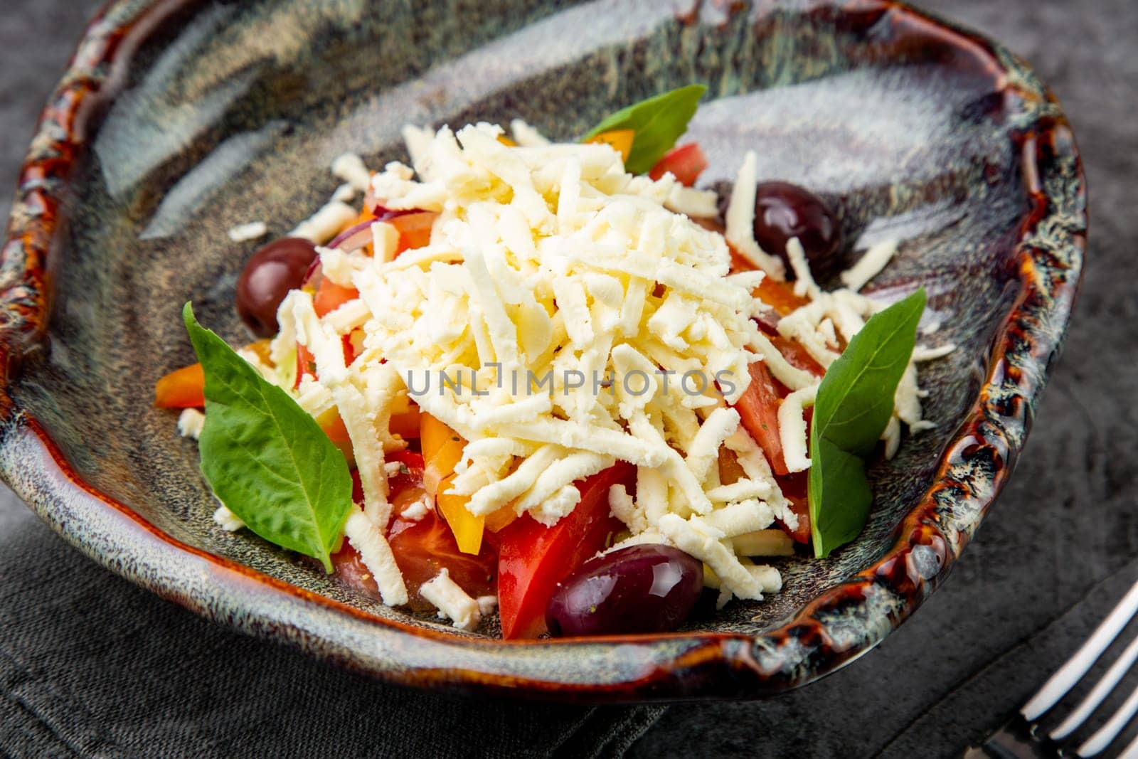 salad with tomatoes, basil, sweet peppers and cheese